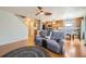 Open-concept living room, open to the kitchen, with hardwood floors and lots of light at 4666 Cornish Way, Denver, CO 80239