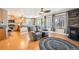 Living room with hardwood floors, fan, fireplace, and natural light at 4666 Cornish Way, Denver, CO 80239
