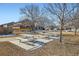 Park area featuring picnic tables and bare trees in a communal outdoor space at 4666 Cornish Way, Denver, CO 80239