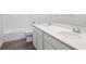 Modern bathroom featuring double sinks, quartz countertops, and sleek fixtures at 45922 Gentry Ave, Bennett, CO 80102