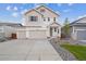 Inviting two-story home featuring a two car garage, neutral colors, and a well-maintained front yard at 45922 Gentry Ave, Bennett, CO 80102