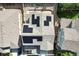 Aerial view of a home with solar panels installed on the roof, surrounded by neighboring houses at 1820 Ghost Dance Cir, Castle Rock, CO 80108
