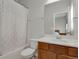 Bright bathroom with vanity, toilet, and shower/tub combo at 1820 Ghost Dance Cir, Castle Rock, CO 80108