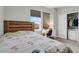 Comfortable bedroom with large window, desk, and walk-in closet at 1820 Ghost Dance Cir, Castle Rock, CO 80108
