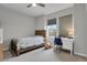 Comfortable bedroom with a ceiling fan, large window, and desk at 1820 Ghost Dance Cir, Castle Rock, CO 80108