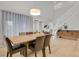Bright dining room with hardwood floors, modern light fixture, and view of the staircase at 1820 Ghost Dance Cir, Castle Rock, CO 80108