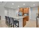 Modern kitchen island featuring granite countertops, bar stool seating and stainless steel appliances at 1820 Ghost Dance Cir, Castle Rock, CO 80108