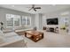 Spacious living room with neutral tones, ceiling fan, and large windows at 1820 Ghost Dance Cir, Castle Rock, CO 80108