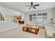 Bright living room with a staircase, hardwood floors, and plenty of natural light at 1820 Ghost Dance Cir, Castle Rock, CO 80108