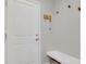Mudroom with a white bench, hooks, and a decorated sign near the door at 1820 Ghost Dance Cir, Castle Rock, CO 80108