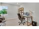 Carpeted office with a large window and a desk with two monitors at 1820 Ghost Dance Cir, Castle Rock, CO 80108