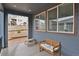 Covered back patio featuring a bench and large windows offering plenty of natural light at 1820 Ghost Dance Cir, Castle Rock, CO 80108