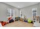Bright playroom with lots of natural light, wooden floors, and lots of toys and storage at 1820 Ghost Dance Cir, Castle Rock, CO 80108