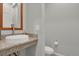 Stylish half bathroom with granite countertop, vessel sink, and modern fixtures at 1820 Ghost Dance Cir, Castle Rock, CO 80108