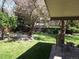 Lush backyard showcases a fire pit lounge area and meticulous landscaping at 2420 S Ellis Ct, Lakewood, CO 80228