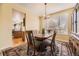 Traditional dining room with wood table and a large rug at 2420 S Ellis Ct, Lakewood, CO 80228