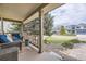 Inviting front porch with comfortable seating, perfect for relaxing outdoors at 2420 S Ellis Ct, Lakewood, CO 80228