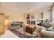 Cozy living room with fireplace and built-in shelving at 2420 S Ellis Ct, Lakewood, CO 80228