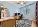 Bright home office with desk, chair, and plenty of natural light at 2420 S Ellis Ct, Lakewood, CO 80228