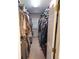 Walk-in closet is designed with ample storage solutions and natural light at 2420 S Ellis Ct, Lakewood, CO 80228