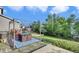 Inviting backyard featuring a deck with a shaded pergola and views of the manicured lawn at 9595 Marmot Ridge Cir, Littleton, CO 80125