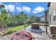 Inviting backyard with deck, pergola, and lush landscaping at 9595 Marmot Ridge Cir, Littleton, CO 80125