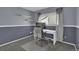 Bedroom featuring neutral walls, carpet floors, and a modern desk space at 9595 Marmot Ridge Cir, Littleton, CO 80125