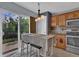 Charming dining area with stylish table, chairs, and a large window for natural light at 9595 Marmot Ridge Cir, Littleton, CO 80125