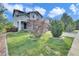 Beautiful home with a well-maintained lawn and mature landscaping, creating great curb appeal at 9595 Marmot Ridge Cir, Littleton, CO 80125