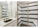 Modern bathroom featuring black and white striped shower, brushed nickel fixtures and quartz vanity at 9244 E 37Th Ave, Denver, CO 80238