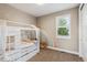 Playful bedroom with a canopy bed, rainbow wall art, and bright natural light at 9244 E 37Th Ave, Denver, CO 80238