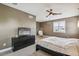 Cozy bedroom with ceiling fan, window shutters, and modern furnishings at 9244 E 37Th Ave, Denver, CO 80238