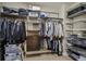 Walk-in closet with custom shelving and ample storage space at 9244 E 37Th Ave, Denver, CO 80238