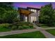 Stunning home featuring modern architecture, a welcoming entrance, and professionally landscaped surroundings at 9244 E 37Th Ave, Denver, CO 80238