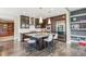 Modern kitchen with a large island, stainless steel appliances, and dark wood cabinetry at 9244 E 37Th Ave, Denver, CO 80238