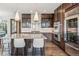 Stunning kitchen features granite island, modern appliances, and custom cabinets for ample storage at 9244 E 37Th Ave, Denver, CO 80238