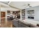 Open-concept living space with a comfortable sofa, modern kitchen, and high ceilings at 9244 E 37Th Ave, Denver, CO 80238