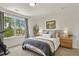 Cozy bedroom features a large window, plush bedding, and bedside tables at 3912 Miners Candle Pl, Castle Rock, CO 80109