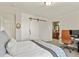 Bright bedroom features barn door closet, modern desk and attached bath at 3912 Miners Candle Pl, Castle Rock, CO 80109