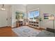 Bright bonus room with hardwood floors and ample natural light streaming through large windows at 3912 Miners Candle Pl, Castle Rock, CO 80109