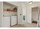 Convenient laundry area with washer, dryer, and shelving for storage at 3912 Miners Candle Pl, Castle Rock, CO 80109