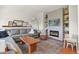 Cozy living room features a modern fireplace, floating shelves, and comfortable seating at 3912 Miners Candle Pl, Castle Rock, CO 80109