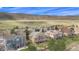 Stunning aerial view showcasing a neighborhood with mountain views and lush greenery in a desirable location at 11065 W Rockland Dr, Littleton, CO 80127