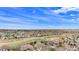 Expansive aerial view showcasing the community's well-maintained homes and open spaces under a blue sky at 11065 W Rockland Dr, Littleton, CO 80127