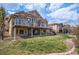 Home with well-manicured lawn and covered patio at 11065 W Rockland Dr, Littleton, CO 80127