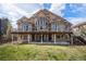 Beautiful backyard view featuring a large deck and well-maintained lawn perfect for outdoor entertainment and relaxation at 11065 W Rockland Dr, Littleton, CO 80127