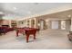 Finished basement with a large recreation area and a billiards table at 11065 W Rockland Dr, Littleton, CO 80127