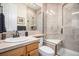 Bathroom with a tile shower, tile flooring, and updated fixtures at 11065 W Rockland Dr, Littleton, CO 80127