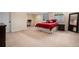 Bedroom with large bed, carpet flooring, and a large mirror at 11065 W Rockland Dr, Littleton, CO 80127