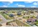 Aerial view of the neighborhood showing the surrounding homes and large plots at 16680 Stroilway St, Hudson, CO 80642